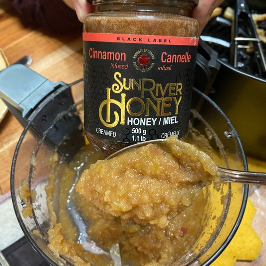 A jar of Sun River Honey Cinnamon Honey and the apple sauce made with it