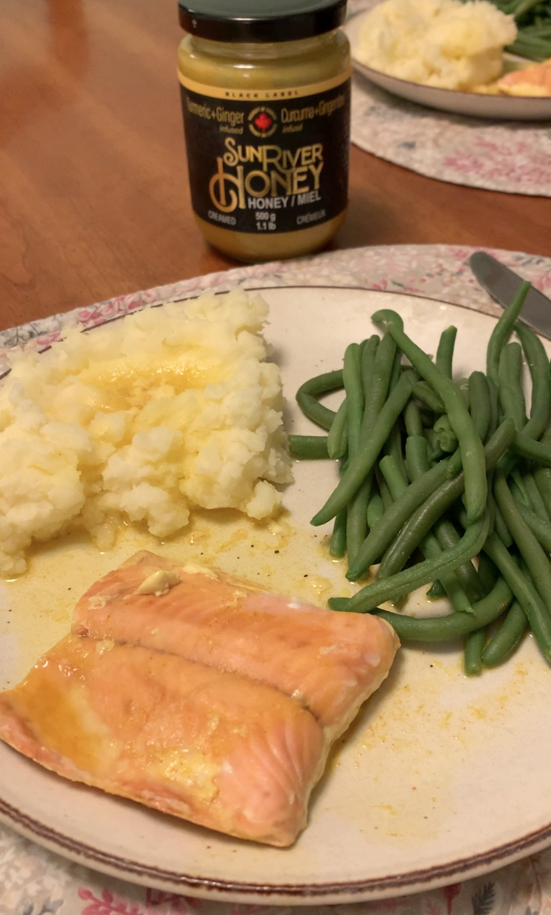 Turmeric Ginger Sun River Honey on baked salmon with mashed potatoes and green beans
