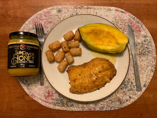 Turmeric/Ginger Infused Sun River Honey on Acorn Squash with fish and mexi-fries