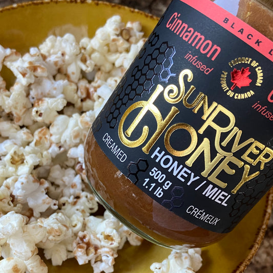 Cinnamon infused honey drizzled overtop of popcorn