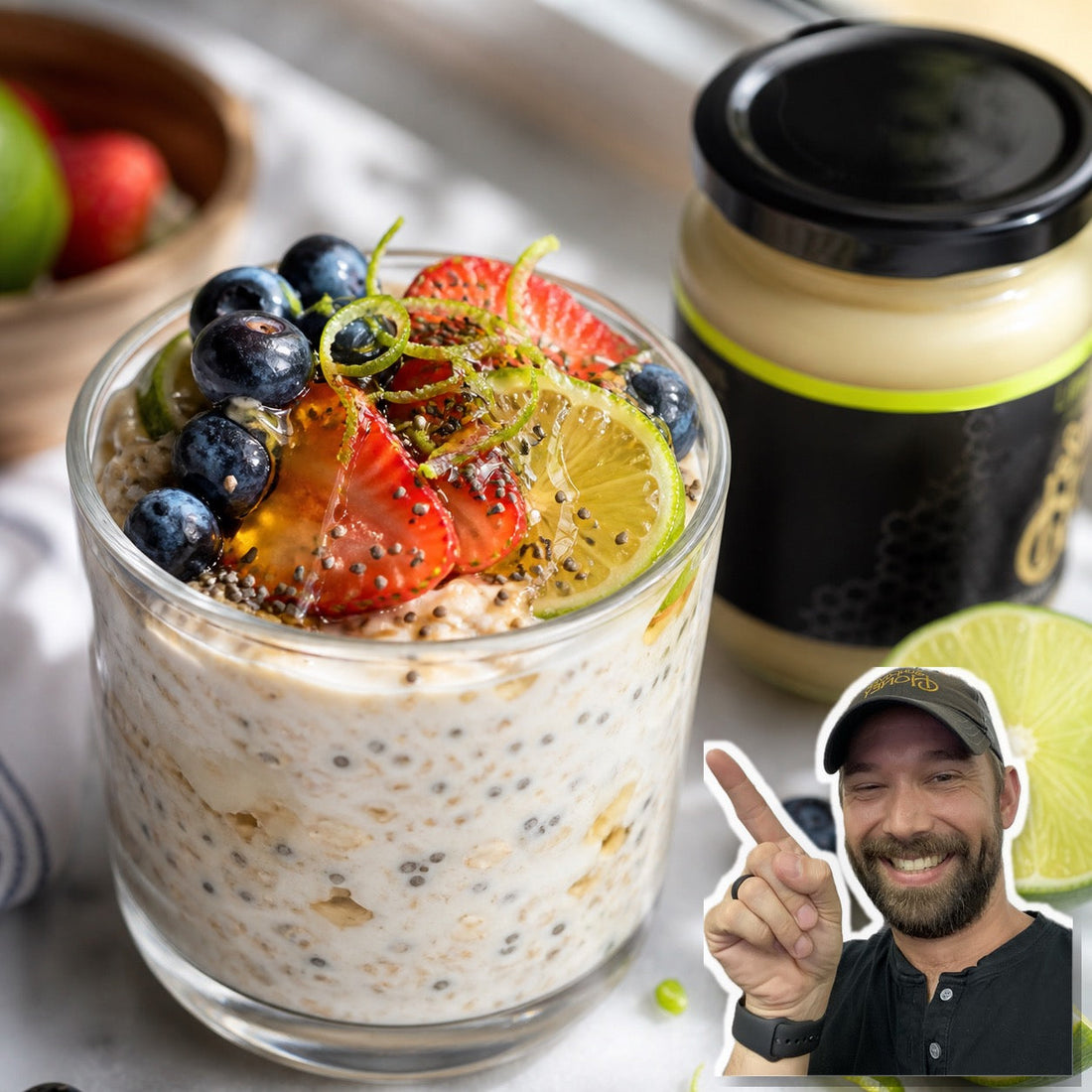 Lime honey overnight oats topped with lime, blueberries, strawberries, chia seeds, and honey beside a jar of Sun River Honey Lime Creamed Honey.